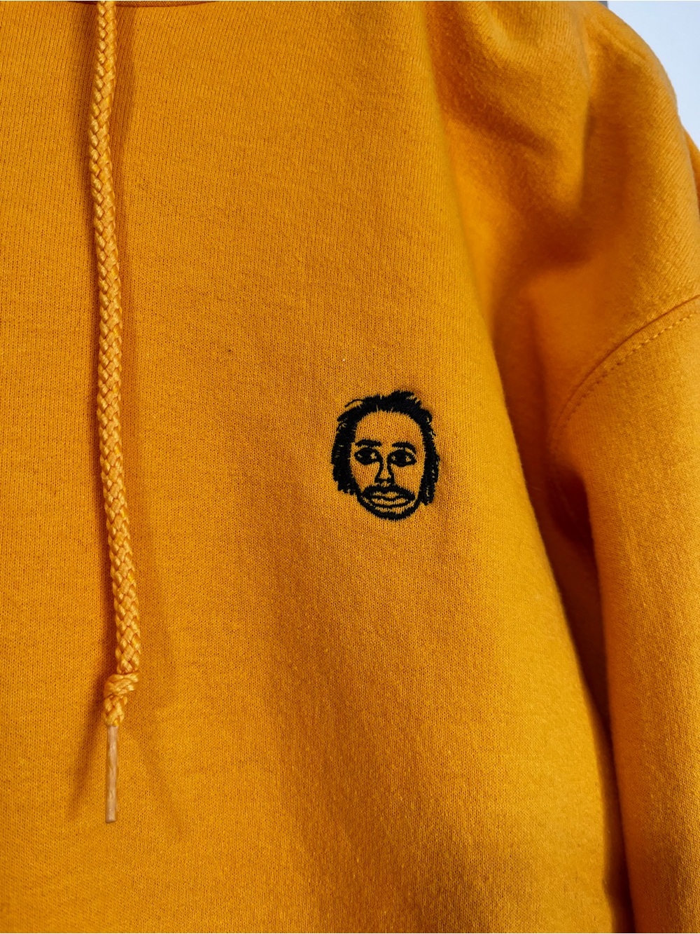 Champion Mustard Yellow Hoodie with Small Embroidered Face of Earl Sweatshirt